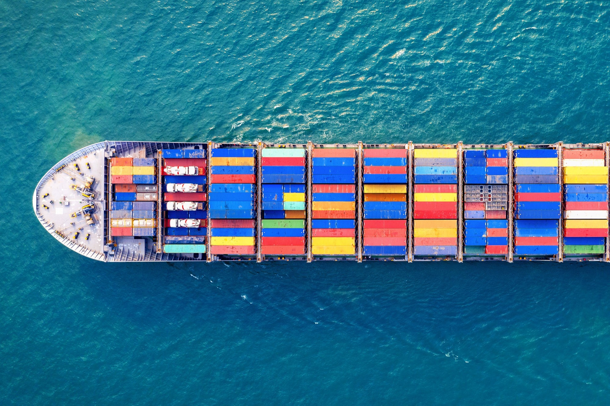 Container ship at sea representing global ocean freight